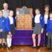 Sandgate Society Members Peter Bamford and Marjorie Findlay Stone present the new memorial board to children of Sandgate Primary School.png